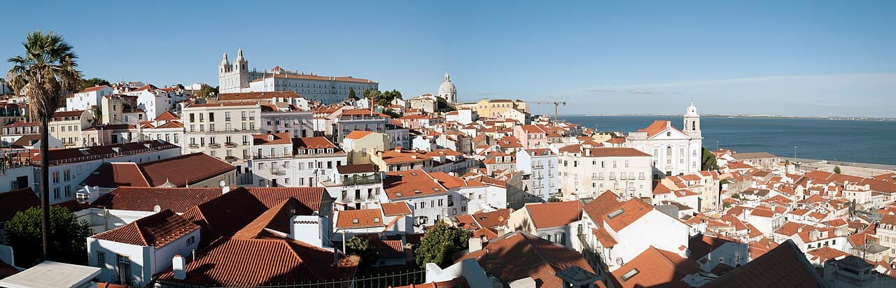 Red-tiled rooftops in Lisbon’s historic district overlooking the Tagus