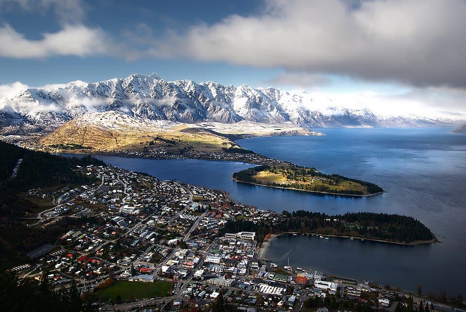 Queenstown beside Lake Wakatipu with snow-dusted mountains across the water
